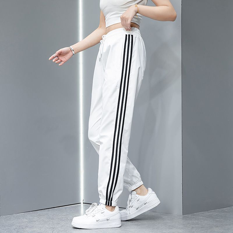 2023 Pantalones deportivos de primavera y otoño pantalones largos casuales para hombres y mujeres Comercio exterior Pareja juvenil suelta slim fit pantalones de chándal atados al tobillo