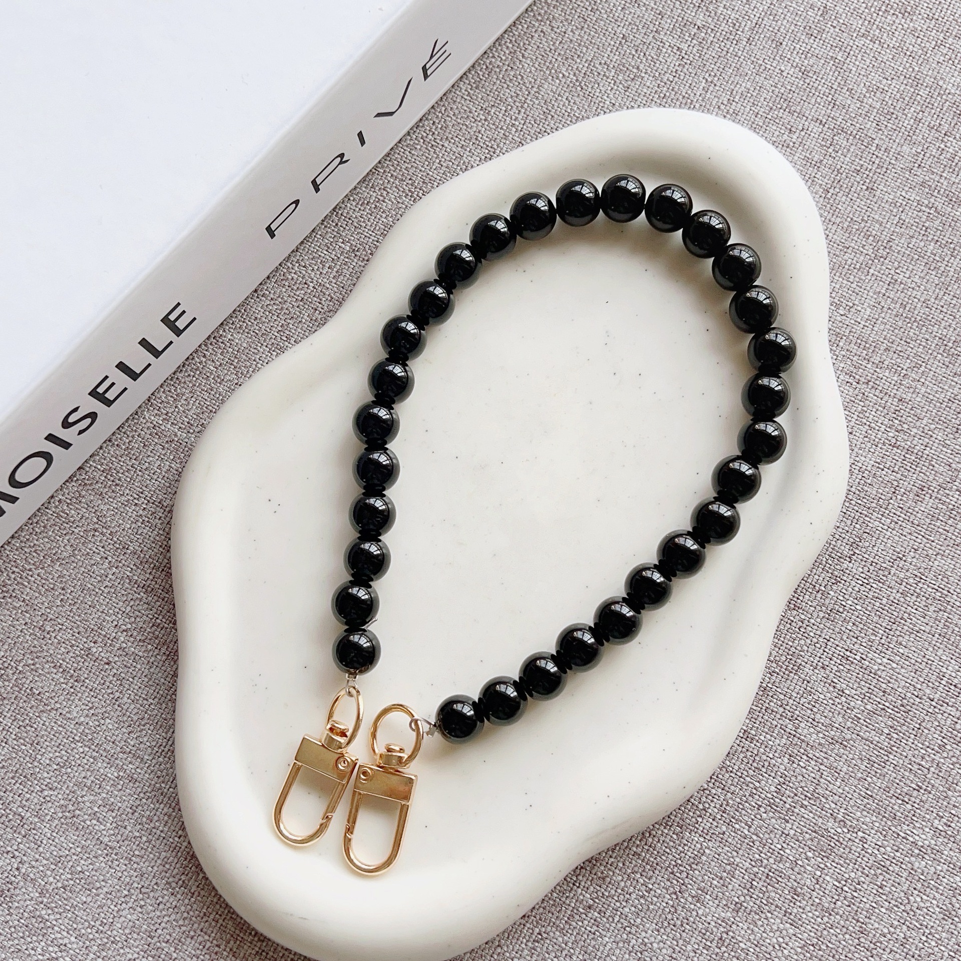 Nuevo estilo japonés y coreano cadena de cuentas de color sólido pulsera corta llavero bolsa de accesorios de cadena de perlas de todo fósforo cordón transfronterizo