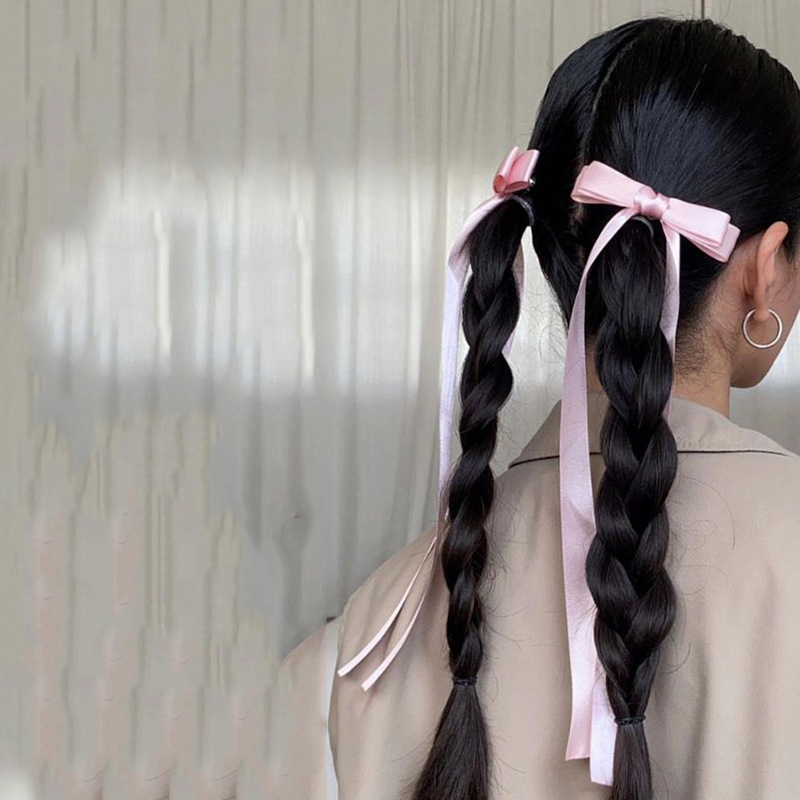 Article populaire du commerce extérieur : Deux pinces à cheveux tressées haut de gamme de style ballet avec de longs nœuds en ruban, à la fois tendance et élégantes._voghion.com