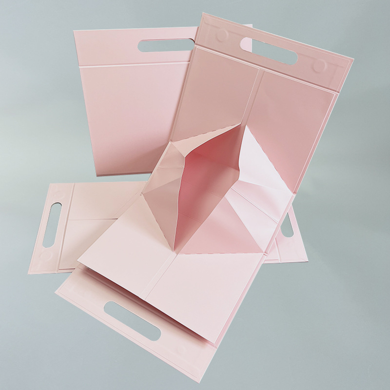 Caja de regalo plegable integrada en stock Caja de regalo plegable triangular rosa blanco negro