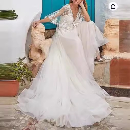 Vestido de noiva etéreo de manga comprida com decote em v_voghion.com