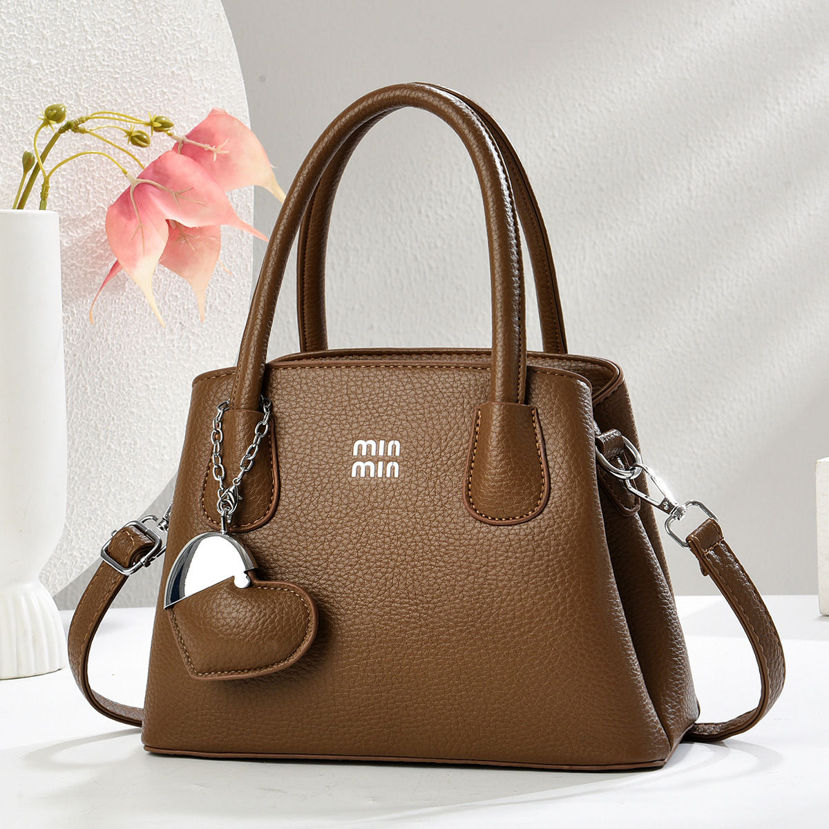 Regalo cálido bolso de mujer bolso de mano mujer 2025 nueva moda atmósfera dama de mediana edad enviar bolso de madre