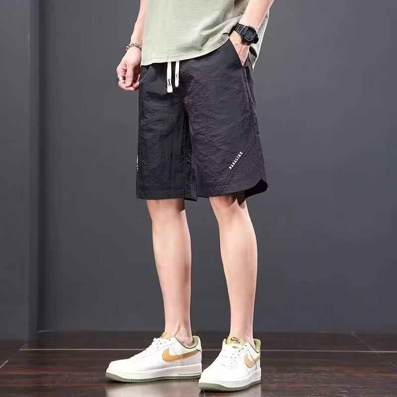 Camisas, menos ropa, pantalones de verano de cinco puntos, holgados y cómodos, todo-fósforo, pantalones casuales de estilo de Hong Kong, deportes para hombres, hombres estadounidenses, de secado rápido