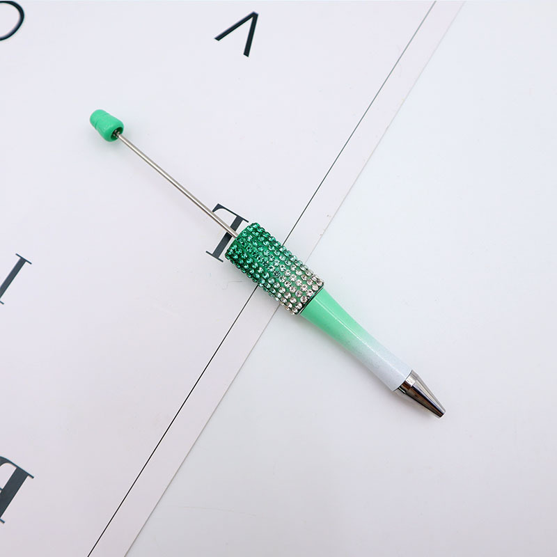 Bolígrafo giratorio de grano lindo de color degradado de tendencia de alto valor Bolígrafo de gomas galvanizado con cuentas de diamantes de bricolaje creativo
