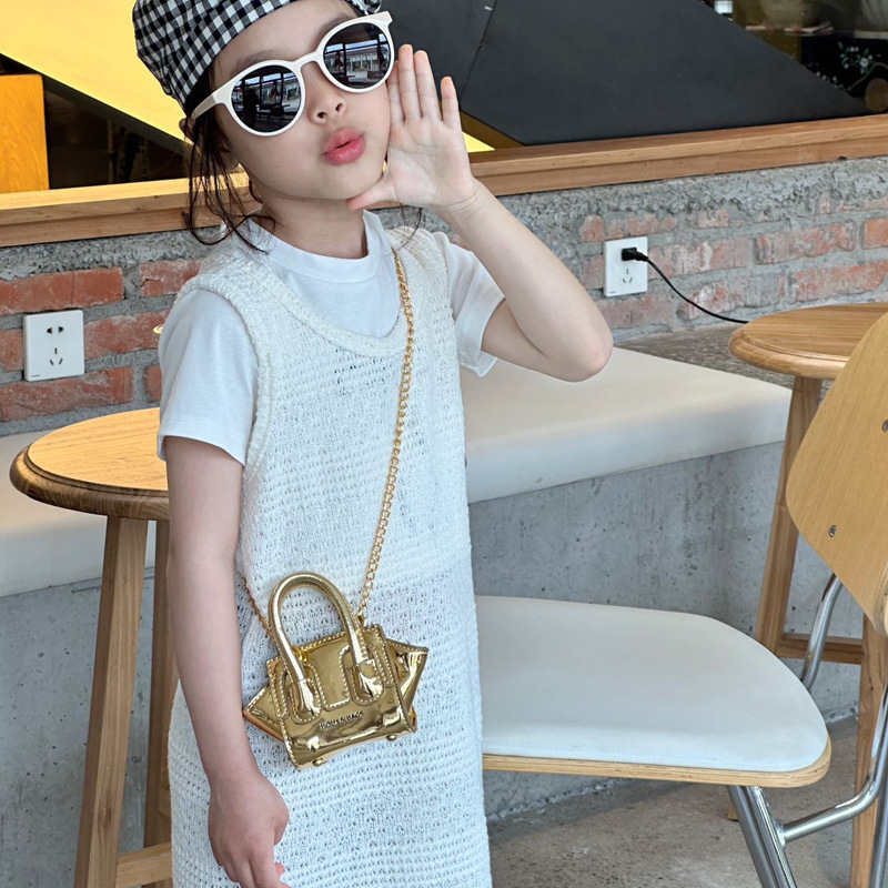 Bolso de hombro para niños y niñas de estilo coreano Bolso de mensajero para niños de color sólido de charol láser fresco de moda Bolso para niños de comercio exterior de cadena nueva