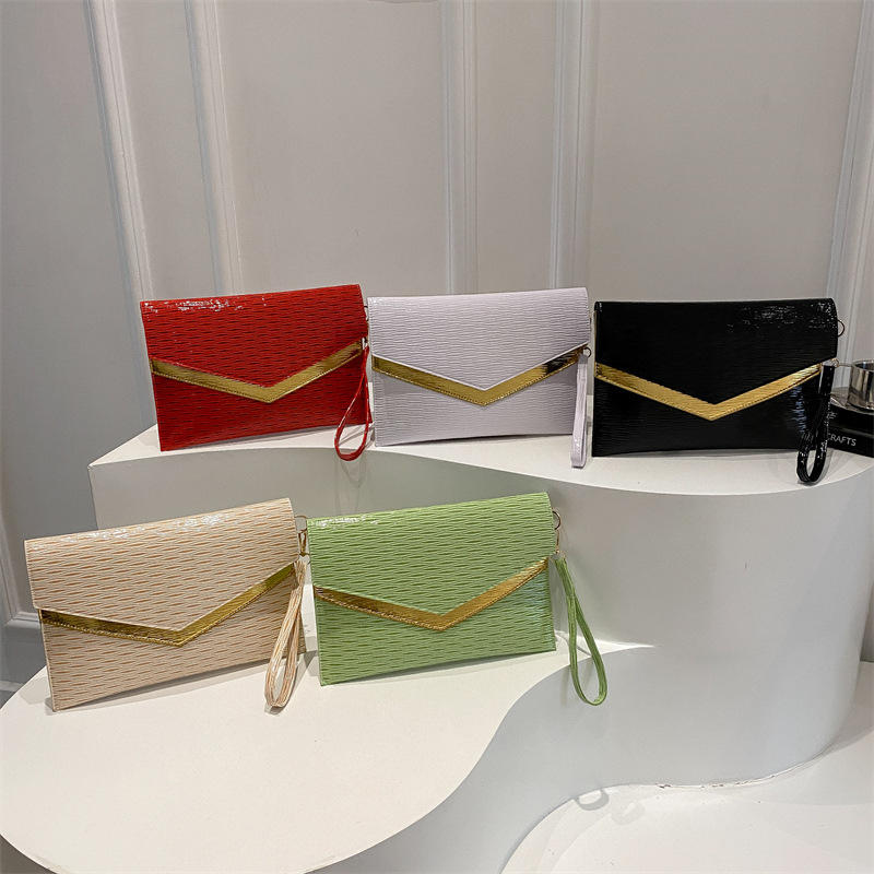 Bolso de sobres de mano de tendencia transfronteriza 2025 primavera nuevo estilo coreano personalidad moda casual temperamento color de contraste bolso de banquete