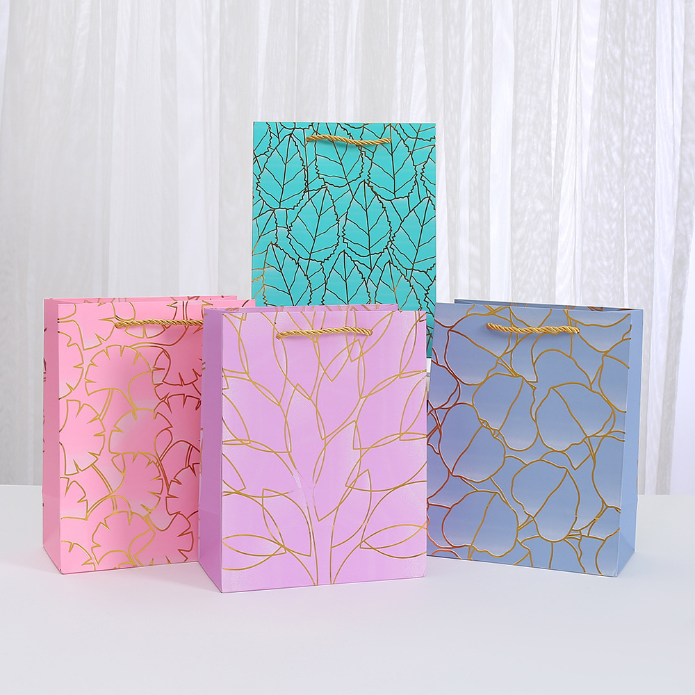 跨境白卡纸烫金白卡纸袋批发购物袋几何图案手提袋印花派对糖果包