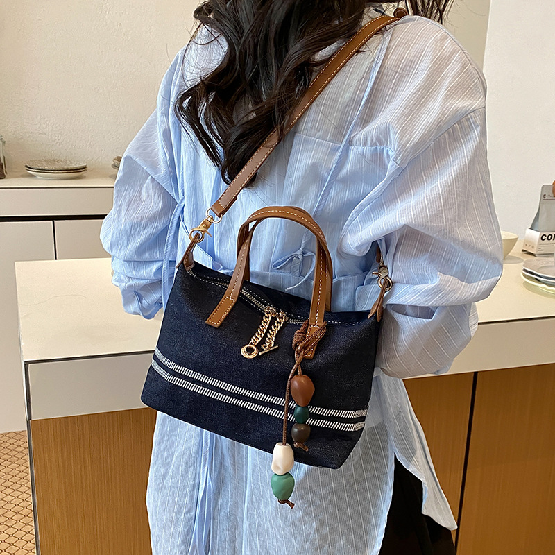 Tela estriada bolso de bolsillo de mano mujer 2026 venta caliente nuevo estilo de alta calidad sensación de moda versátil bolso de hombro