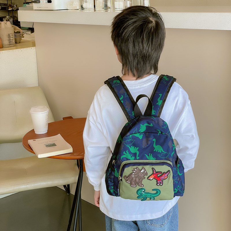 Mochila infantil de dinosaurios de dibujos animados, 2025 mochila escolar de jardín de infantes, nueva mochila de comercio exterior para niños y niñas