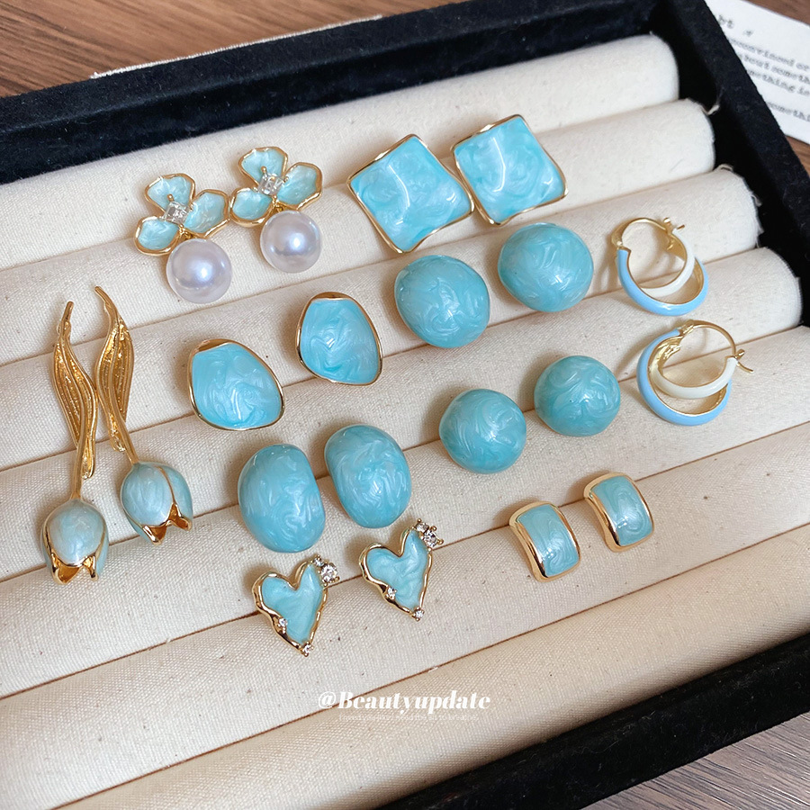 Pendientes de borla de flores de tulipán de aceite de goteo de aguja de plata Primavera/verano 2025 Pendientes nuevos de nicho de alta gama al por mayor