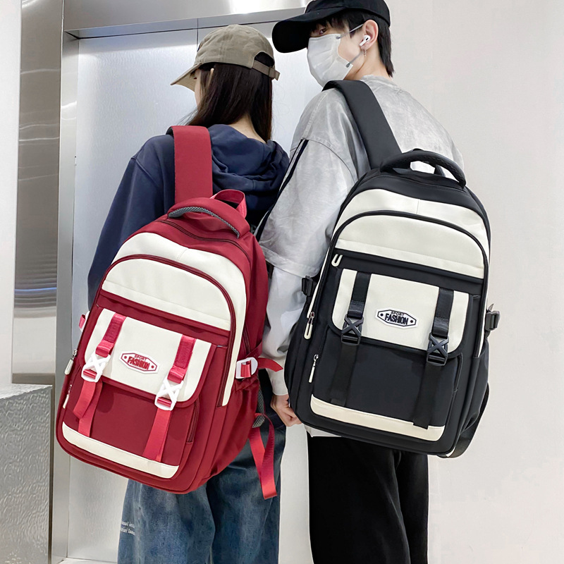 Mochila transfronteriza mayorista de estudiantes de secundaria y secundaria mochila de gran capacidad de ocio pequeña fresca de color reducción de carga mochila de viaje