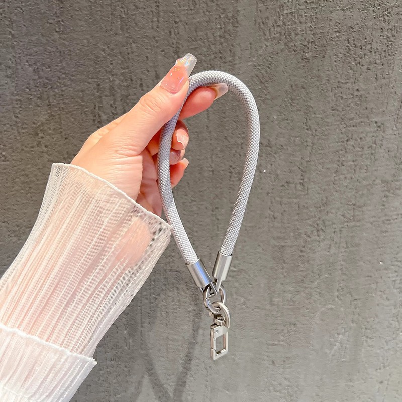 メーカーは、屋外で便利な紛失防止、強力で耐久性のあるポータブルな8mm手首タイプの高密度織り携帯電話ストラップを製造しています。|undefined