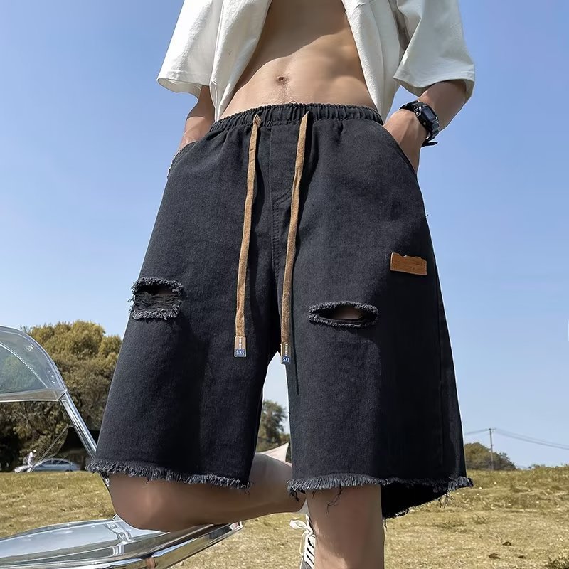Pantalones cortos de mezclilla rasgados con bordes sin rebabas para hombre American High Street retro verano delgado casual tendencia guapos pantalones de cinco puntos