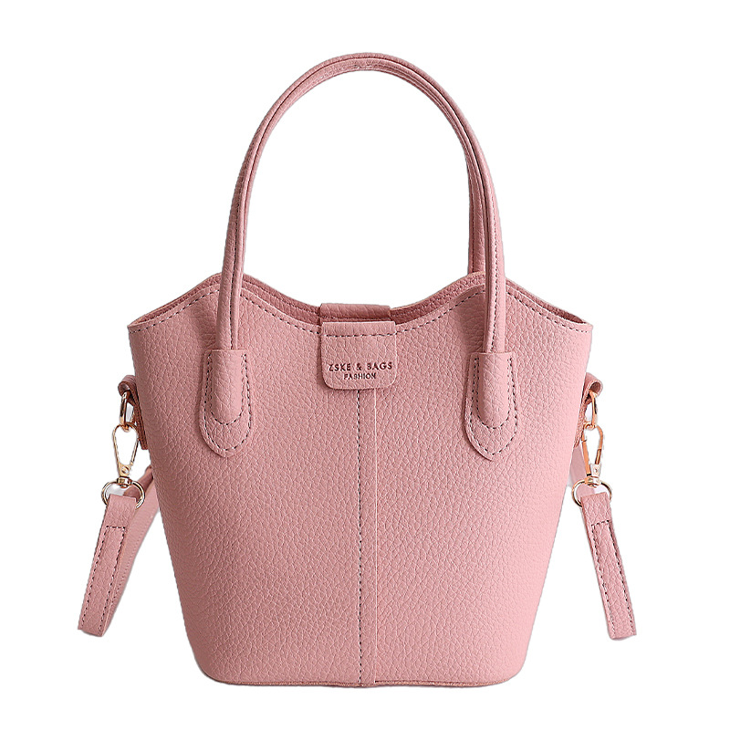 Bolso de mano de moda retro 2026 nuevo temperamento simple bolso de cubo de viaje ocio mochila de hombro