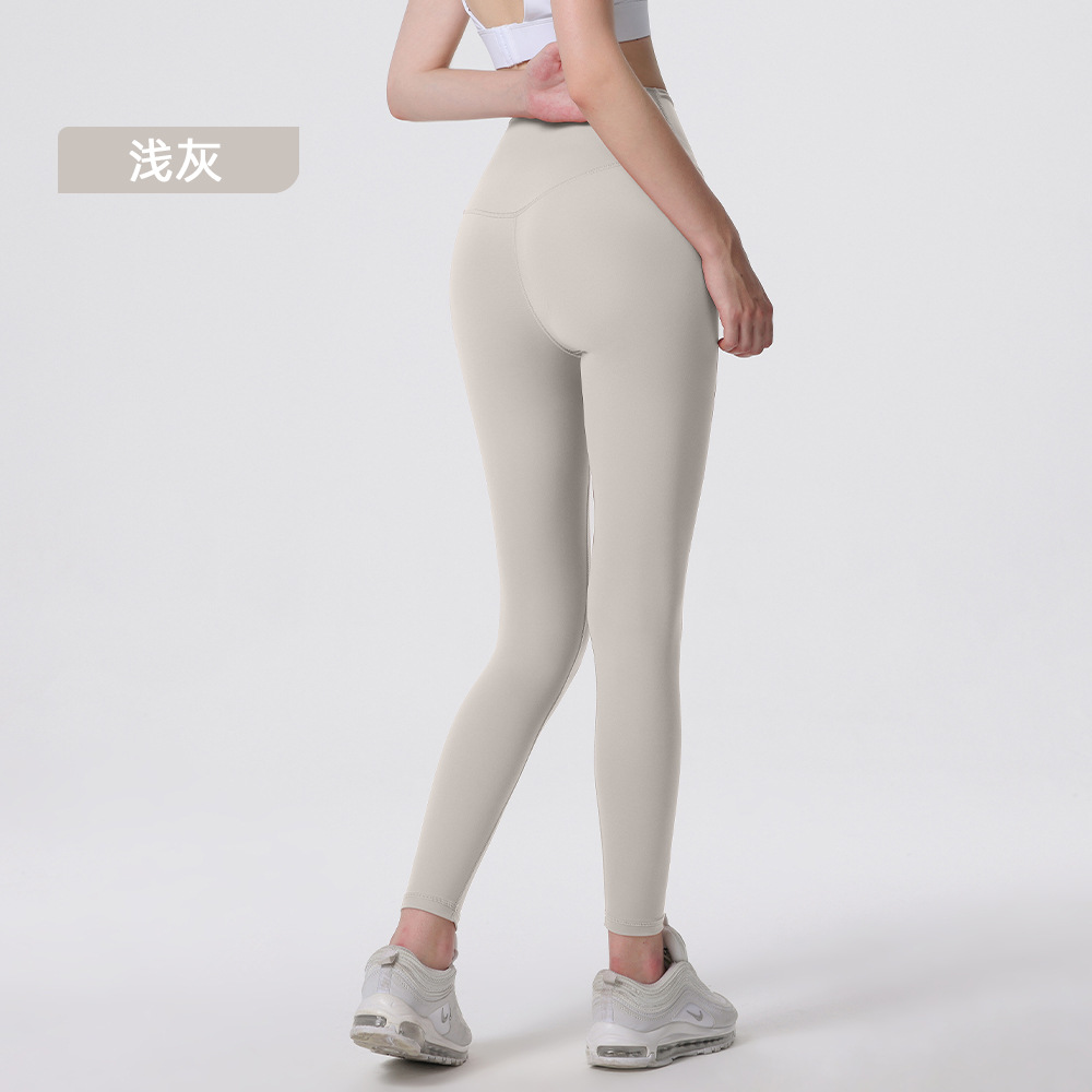 Nuevos deportes de yoga cintura alta desnuda sensación de no vergüenza línea piel-friendly levantamiento de la cadera del vientre que no se contrae la caída de la aptitud de las mujeres pantalones recortados