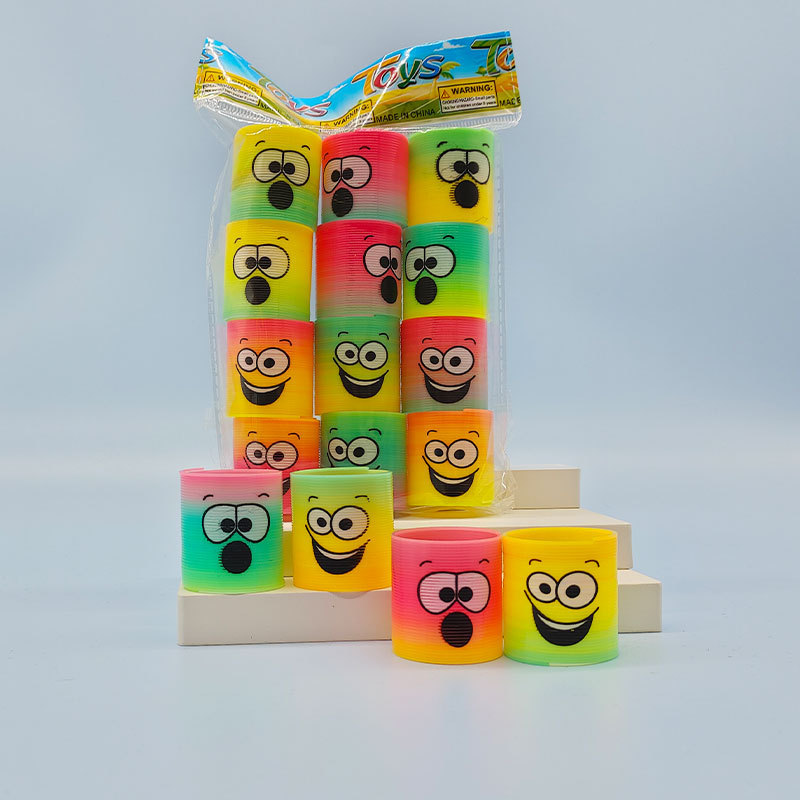 Regalo de trompeta de anillo de primavera de venta caliente transfronteriza, rompecabezas, nostalgia, sonrisas sonrientes apiladas, música mágica círculo del arco iris