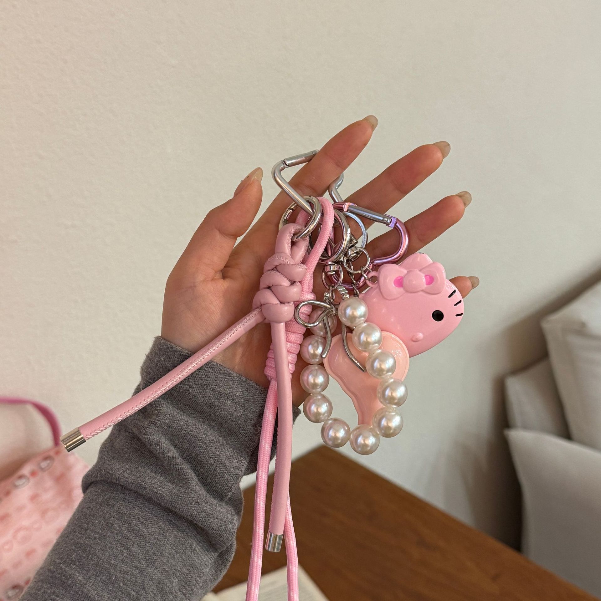 Original DIY hecha a mano colgante rosa KT gato personalidad bolso colgante Miu pareja trenzado colgante bolso colgante