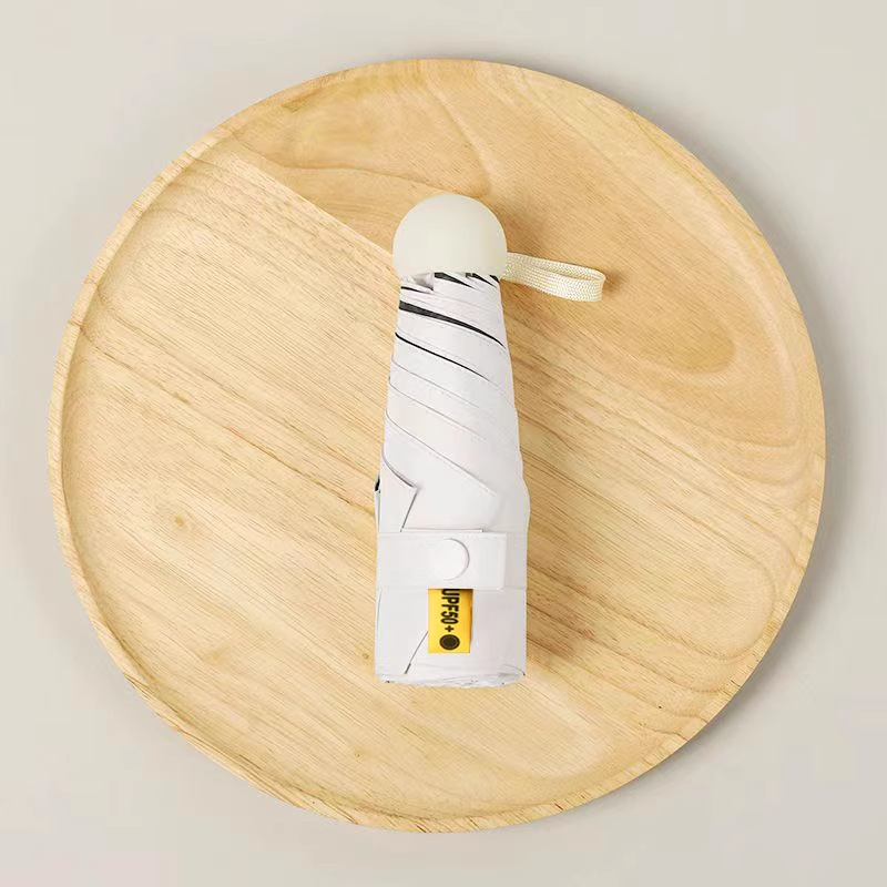 50% de descuento sol y lluvia paraguas de protección solar paraguas de sol UV portátil compacta cápsula sombrilla personalizada