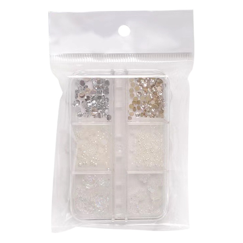 Joyería de uñas Aurora arco perla remache pequeños accesorios Super Flash pequeño diamante 12 rejilla mixta decoración de uñas al por mayor