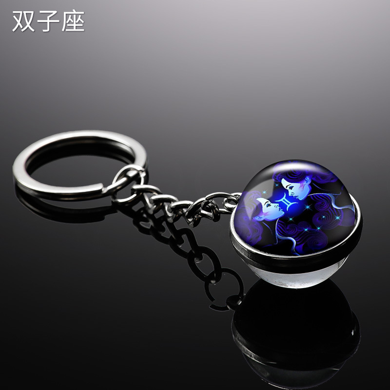 Transfronterizo 12 constelaciones de luz nocturna bolsos colgantes de bolsas de joyas de tiempo doble cara bola de vidrio llavero al por mayor