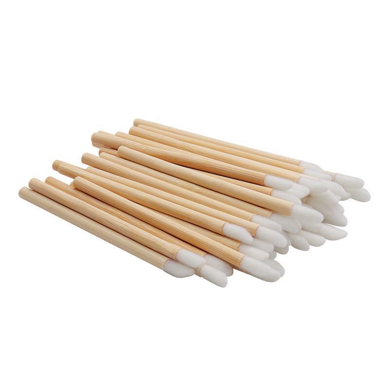 Fábrica venta al por mayor cepillo de labios desechables mango de bambú cepillo de labios flocado cepillo de labios cepillo de brillo de labios 50 piezas un paquete