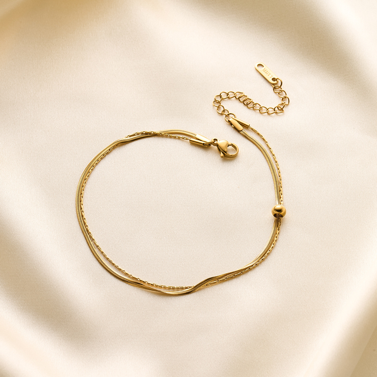 Nuevas cuentas de acero de titanio, tobillera de doble capa móvil, cadena de hueso de serpiente, bola de oro pequeña, verano de oro de 18k, nuevo adorno de pie de todo fósforo