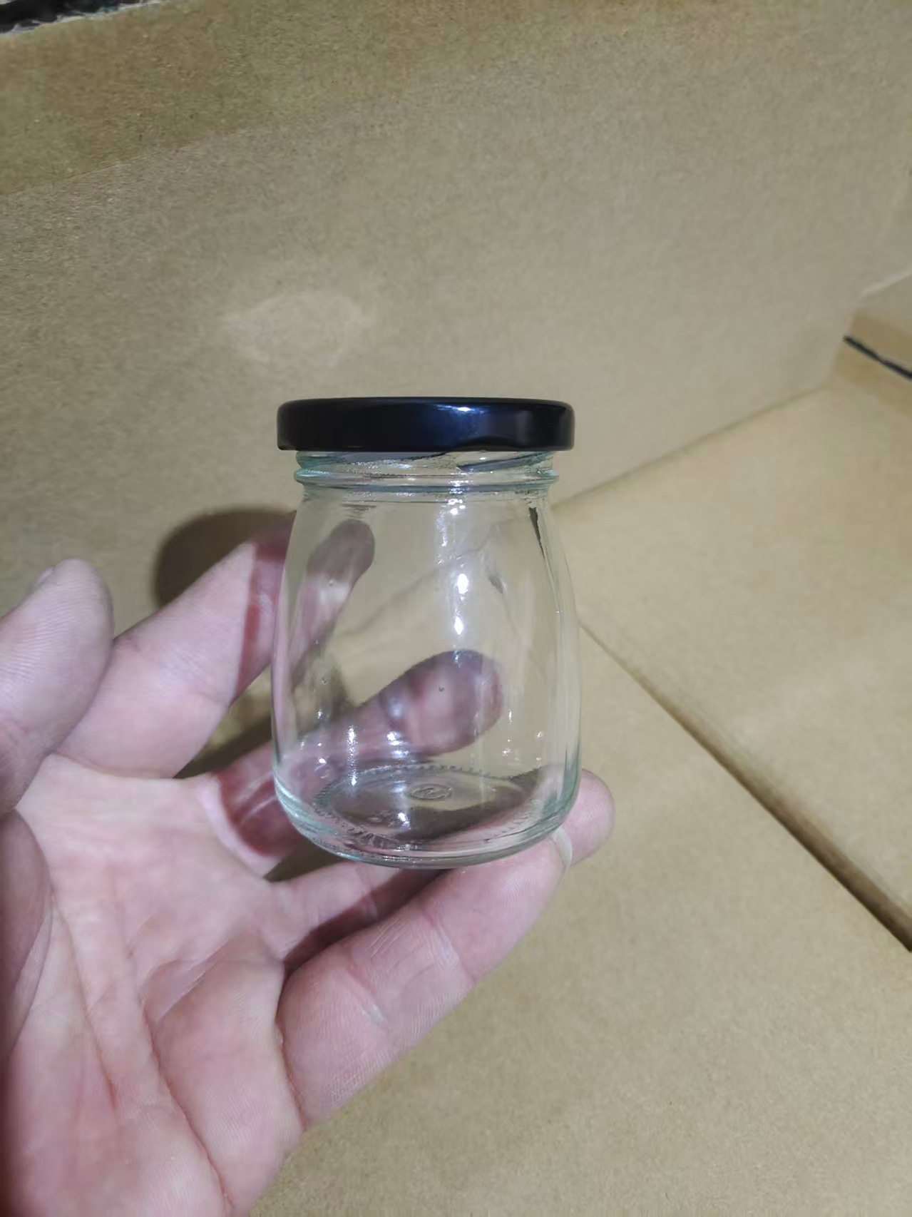 卸売り100mlガラス布丁瓶厚手牛乳カップ耐高温ヨーグルト瓶木栓ガラス瓶許瓶瓶