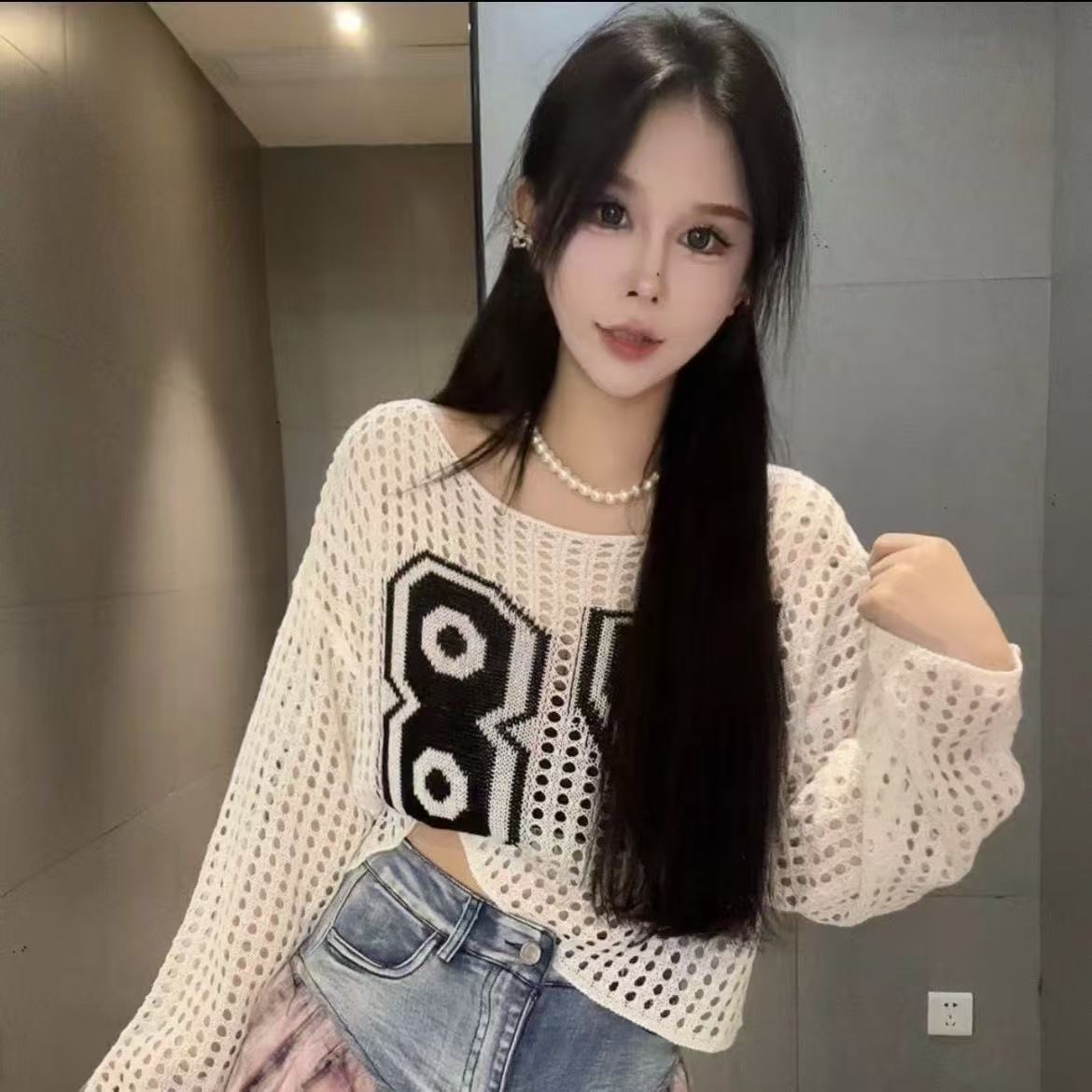 2025 verano chaqueta de mujer caliente hueco corto camisa de punto protector solar principios de otoño nuevo suéter blusa chaqueta de mujer
