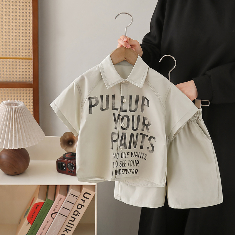 7192 traje de verano para niños 2025 nueva camisa con estampado de letras de manga corta de estilo occidental verano de dos piezas para niños verano