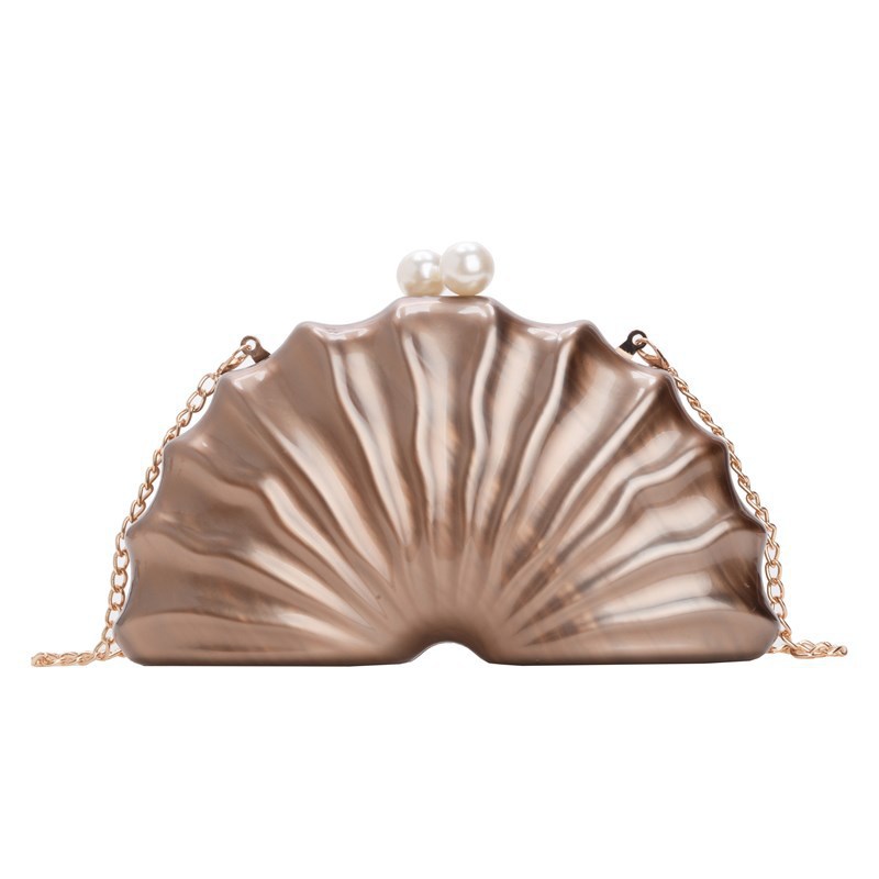 Europa y los Estados Unidos nuevos paquetes de cena de damas de hombro único en forma de concha acrílica de mano de lujo ligero paquete de moda de noche