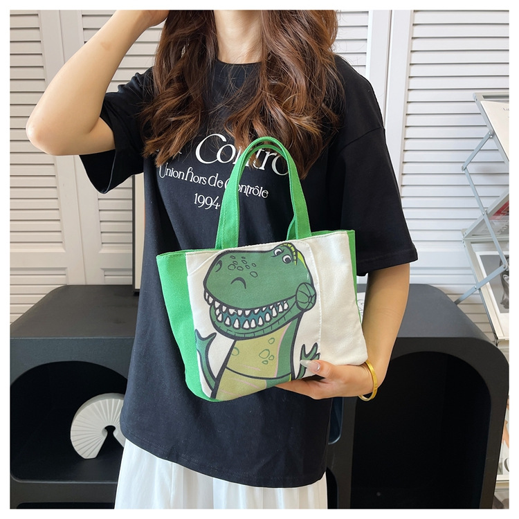 Cute cartoon printed small bag, 2024 summer new style hand-held piggy girl handbag, student storage canvas bag undefined