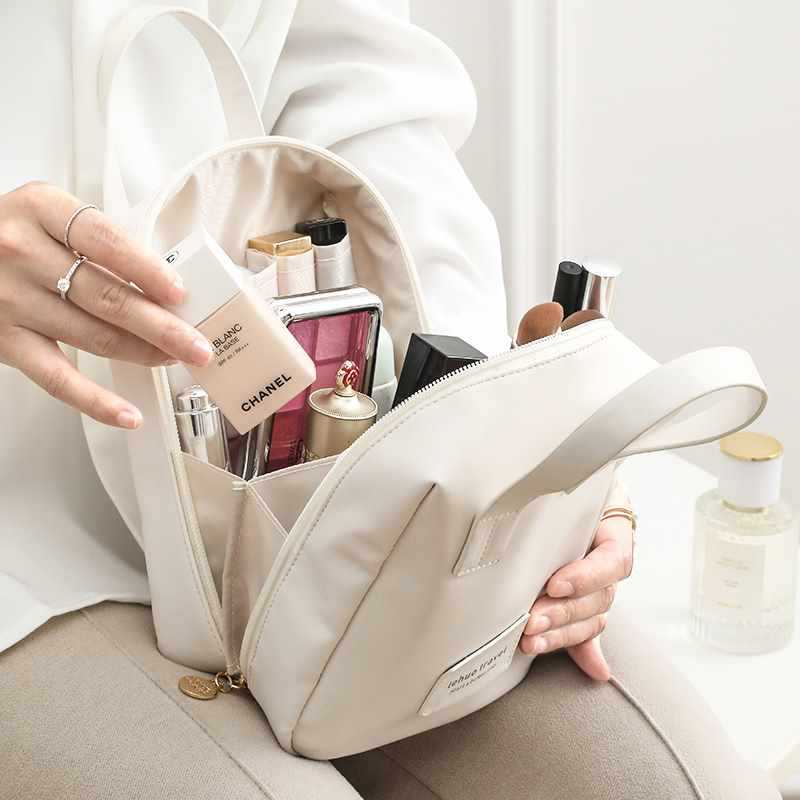Capacious handheld cosmetic bag for traveling