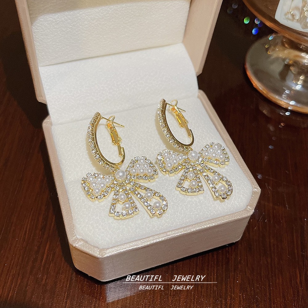 S925 aguja de plata elegante borla pendientes de alta gama simple cara de adelgazamiento pendientes de todo fósforo estilo coreano nuevos pendientes de moda al por mayor