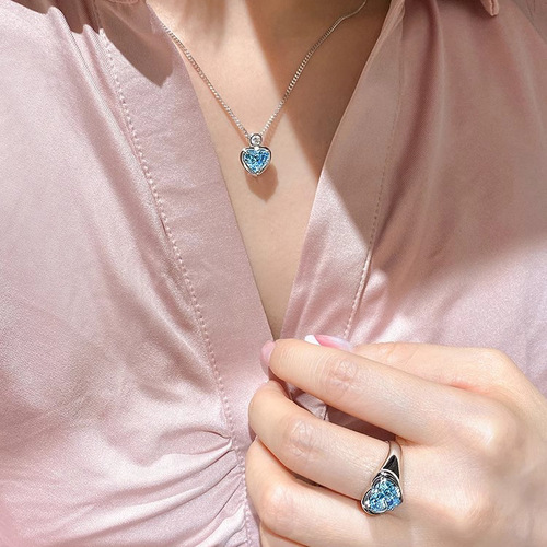 Heart-shaped pendant necklace for women with 2-carat blue diamond and aquamarine artificial diamonds, exuding a unique and sophisticated charm.