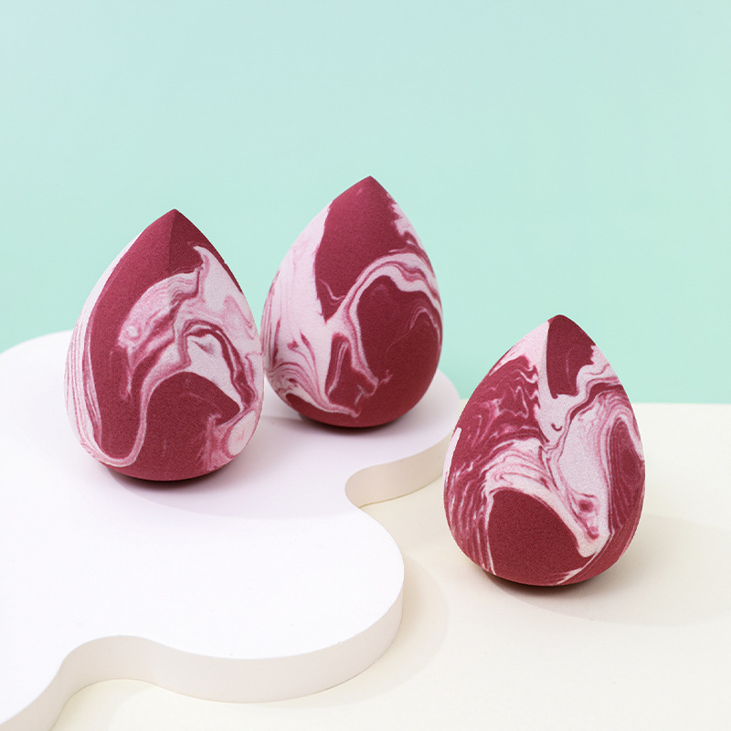 Maquillaje de belleza de color mixto, soplo de polvo de huevo, sin polvo, logotipo personalizado de fábrica, gota de agua sin látex, esponja de maquillaje en forma de calabaza, cojín de aire