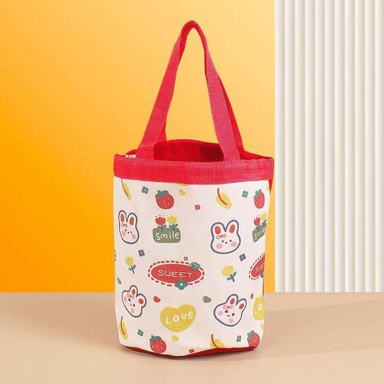 かわいい落書きバケツバッグinsプリント円筒バッグキャンバス弁当袋韓風少女は弁当箱を持っています。|undefined