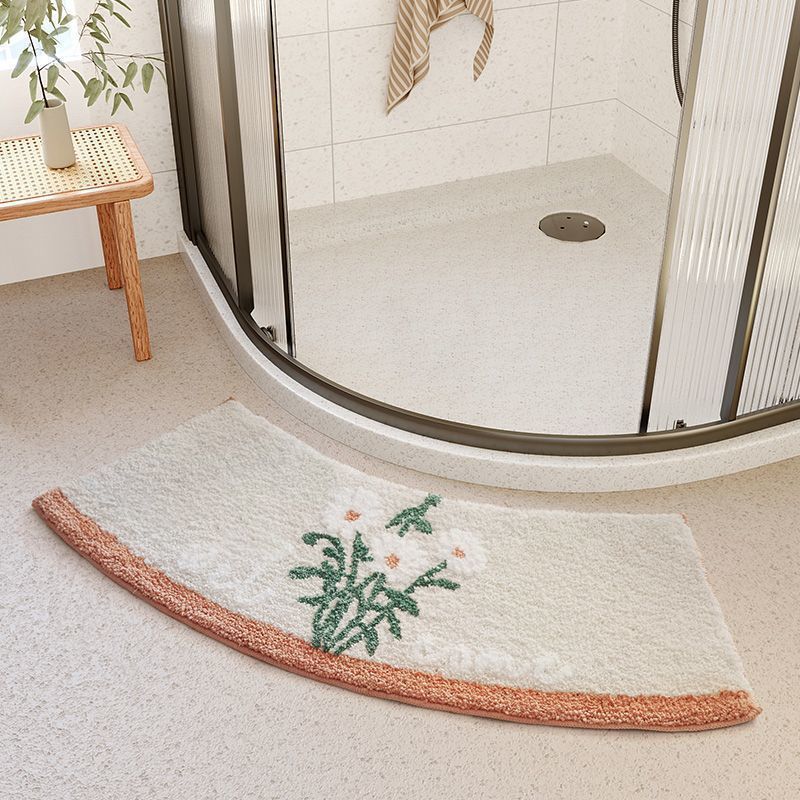 Fresh crooked soft carpet made of faux fur, duvet, water absorbent