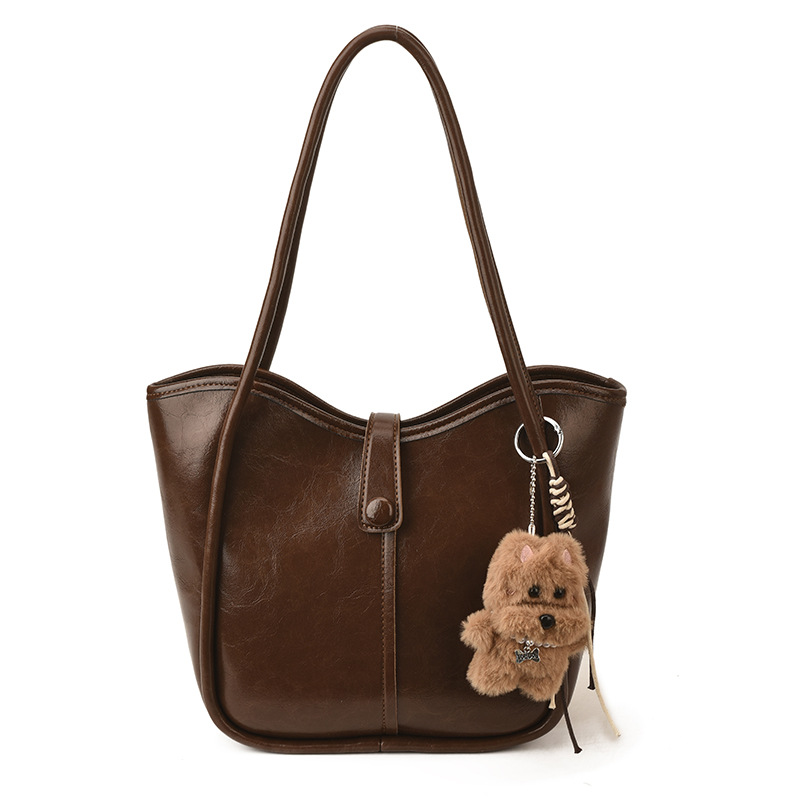 Este año, la moda simple bolso de cubo de mujer venta caliente nueva textura de alta calidad retro versátil lujo ligero bolso de hombro