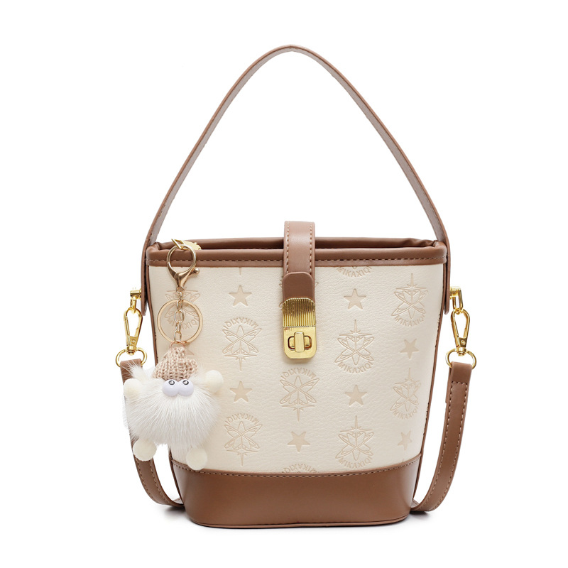 Super caliente bolso de cubo de mano mujer 2025 nueva moda relieve bolso de hombro de alta calidad humedad versátil bolso de mochila