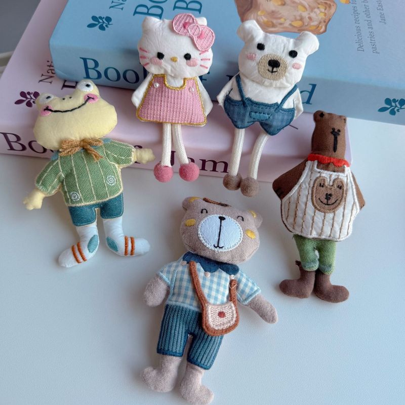 新しい布芸のかわいい蝶結びのマフラーの熊の包みのブローチの髪飾りは漫画のDIYの服装の補助材料を飾ります。|undefined