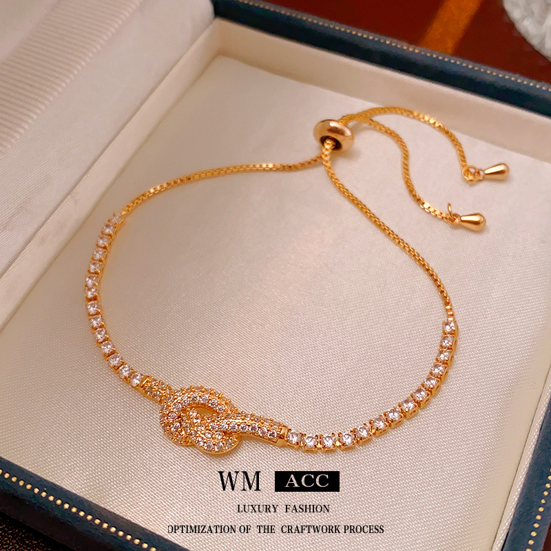 Real oro galvanizado ZIRCON anudada pulsera hueco simple pulsera elegante luz lujo alto sentido pulsera para las mujeres al por mayor