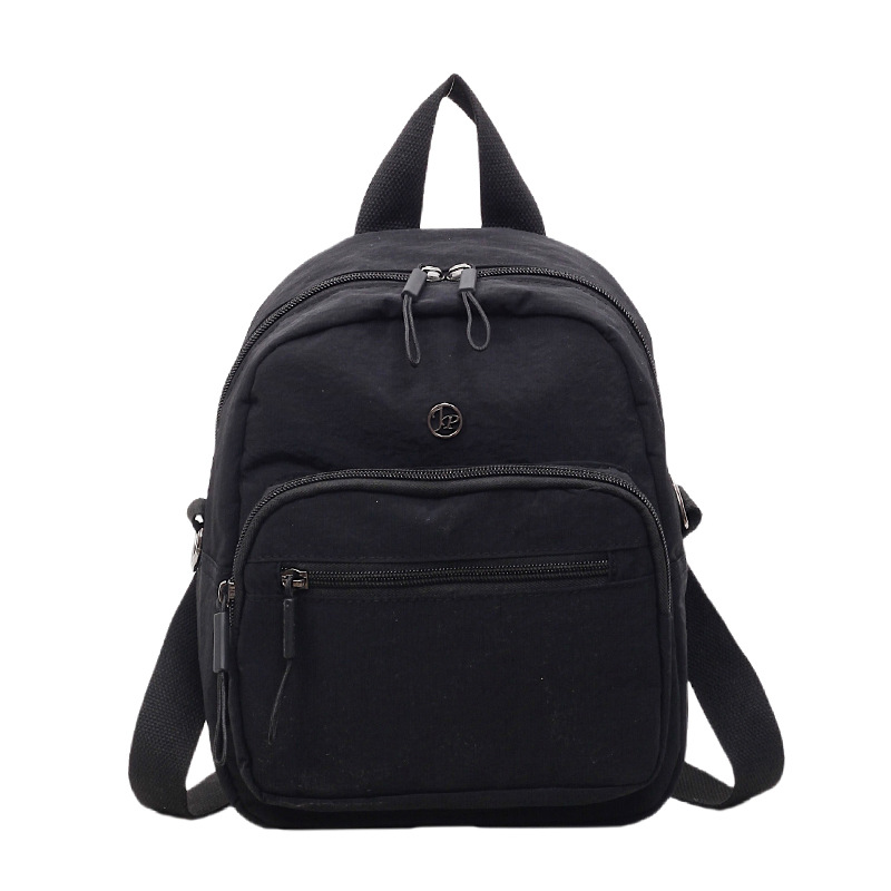 Mini mochila ligera coreana de moda casual mochila de viaje al aire libre de viaje de viaje simple mochila de estudiantes