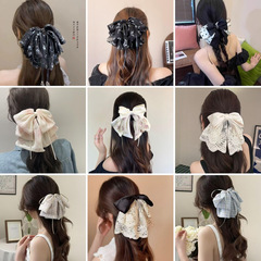 フランスの重厚でエレガントな立体リボンヘアアクセサリー、女性の年齢を軽減する新しいプリントの高級リボンポニーテールクリップ