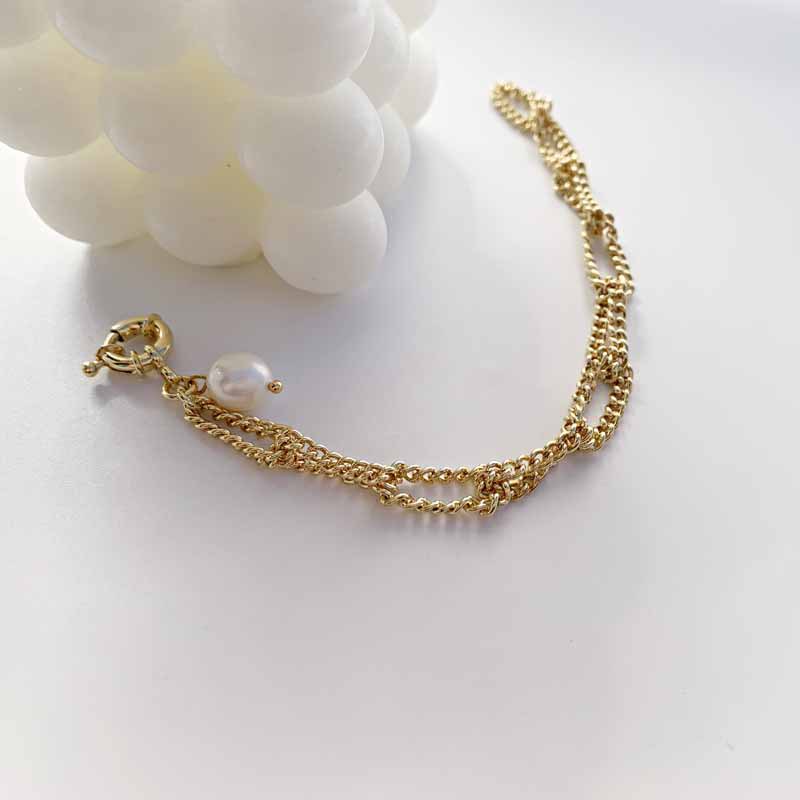 Baroque Fashion Pearl Pendant Twist Knotted Chain Copper Bracelet display picture 1