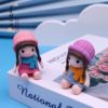 Factory direct selling gifts four -color hat girl cartoon small gift novel practical doll craftsmanship ornaments