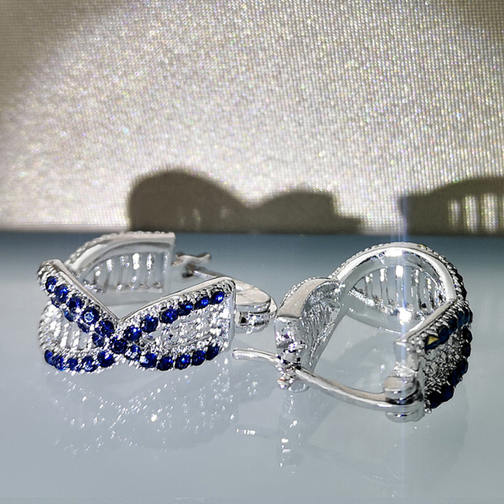 Cao Shi's Advanced Sense Treasure Blue Zircon Earrings with Korean Version Temperament and Personality Cross Hip Hop Style Earrings_voghion.com