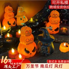 カボチャのランプハロウィーン電子ろうそくのランプが光る道具を飾っています。