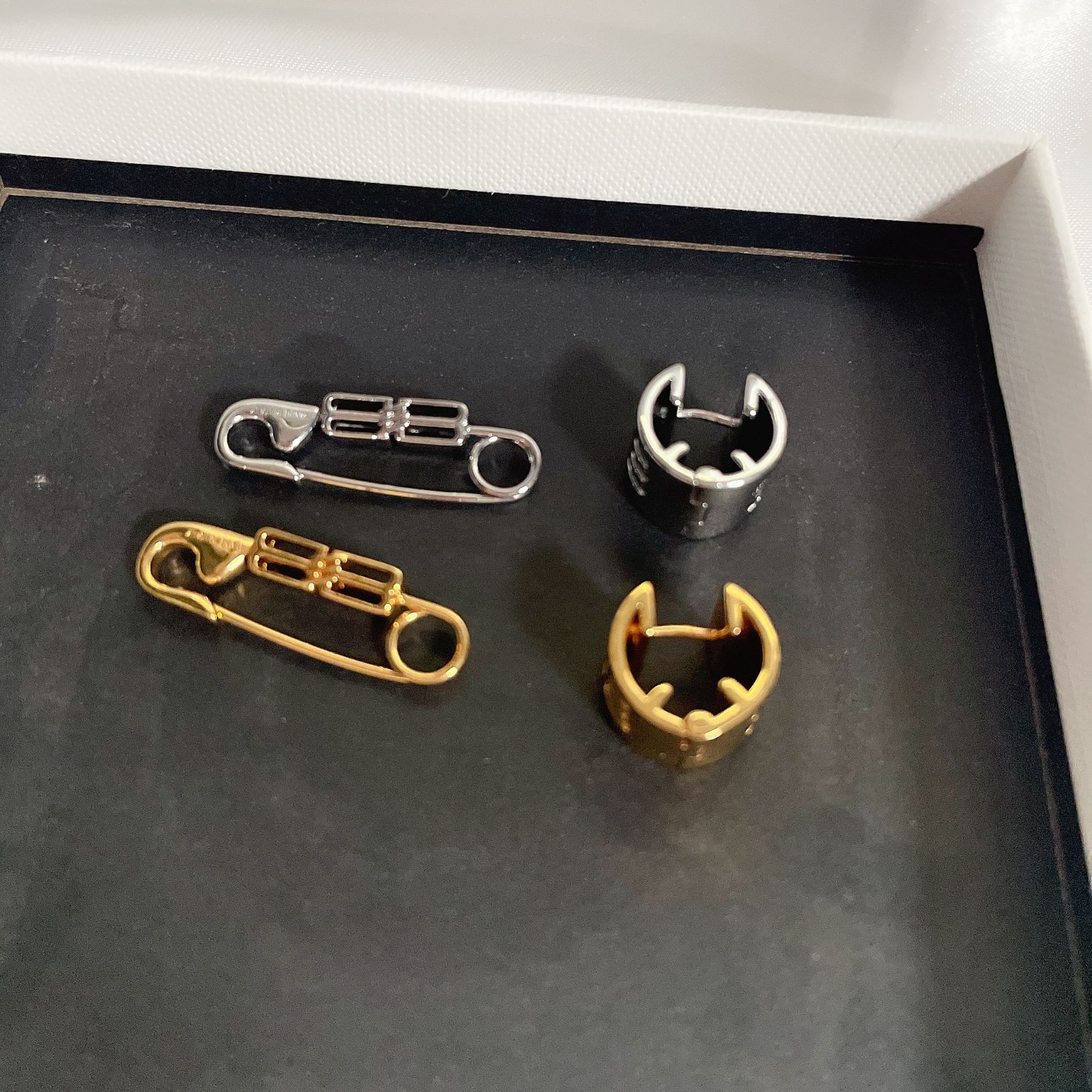 Parisian-style unique pin earrings in gold and silver, asymmetrical, versatile, street-style, trendy, unisex earrings