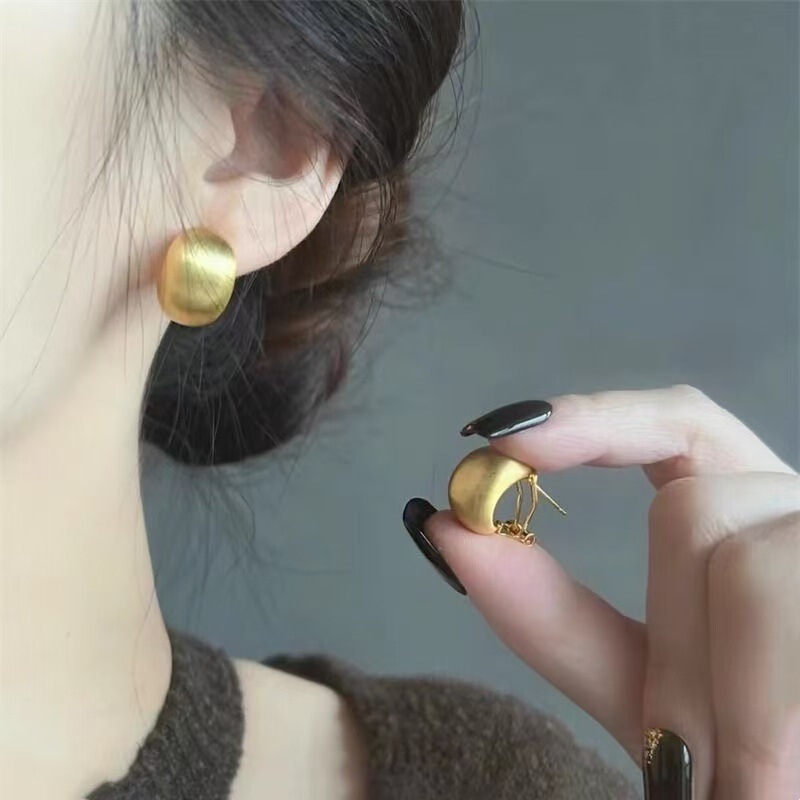 High-end, light-luxury, niche design earrings. French vintage gold matte finish earrings with original design and elegant studs High-end, light-luxury, niche design earrings. French vintage gold matte finish earrings with original design and elegant studs
