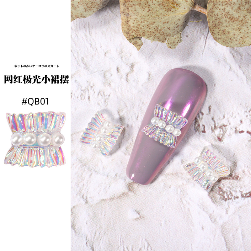 Accesorios de falda de arte de uñas 2021 nueva celebridad de Internet pequeño libro rojo estilo caliente hada aurora falda plisada decoración de uñas